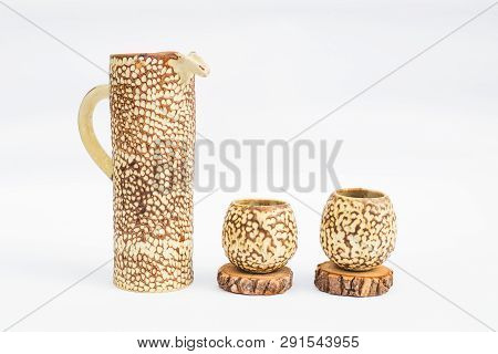 Pitcher And Two Ceramic Stoneware Glasses With White Background