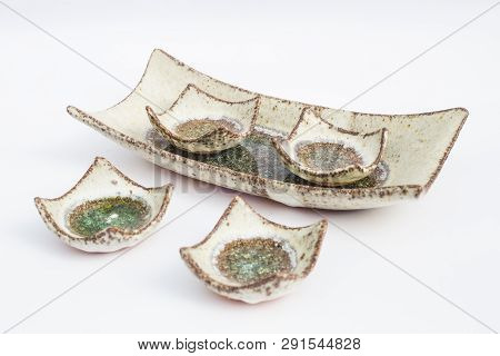Five Ceramic Stoneware Wells With White Background