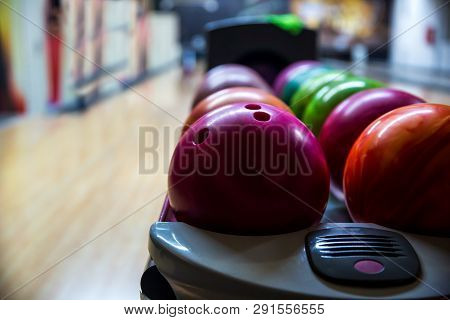 Bowling Balls And Wooden Lane In Bowling Hall. Leisure Concept
