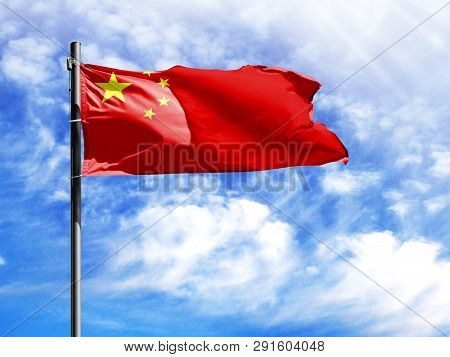 National Flag Of China On A Flagpole In Front Of Blue Sky.