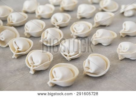 Dumplings, A Lot Of Raw Dumplings On A Gray Background, Semifinished Products
