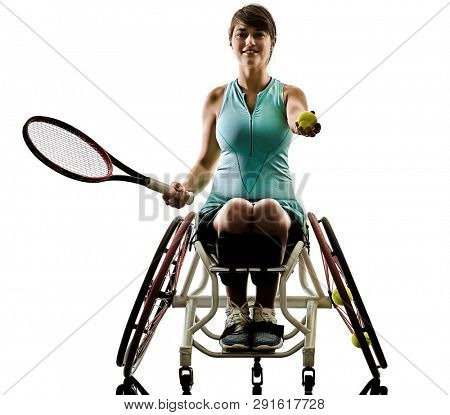 one caucasian young ped basket ball player woman in wheelchair sport tudio in silhouette isolated on white background