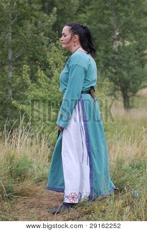 KIEV, UKRAINE - JULY 31: Member of history club Golden Capricorn wears medieval costume as she participates in historical festival in memory of King Vladimir July 31, 2009 in Kiev, Ukraine.