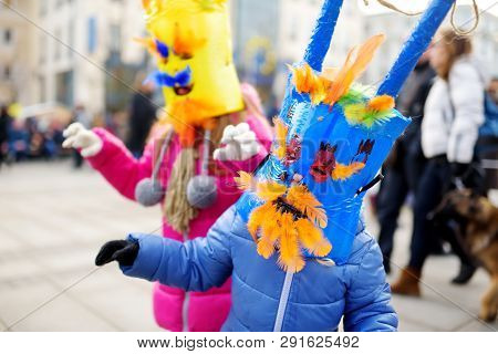 Two Cute Girls Wearing Frightening Masks During The Celebration Of Uzgavenes, A Lithuanian Annual Fo
