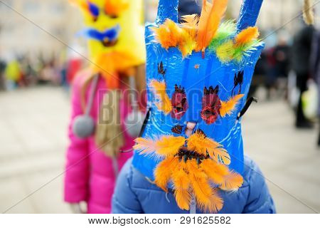 Two Cute Girls Wearing Frightening Masks During The Celebration Of Uzgavenes, A Lithuanian Annual Fo