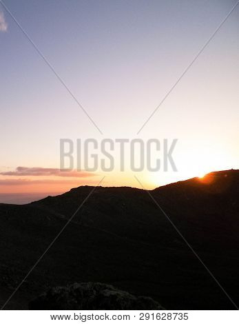 Beautiful Sunset Over Extinct Volcano Montana Roja. Montana Roja Is A Volcano On Lanzarotte, Canary 