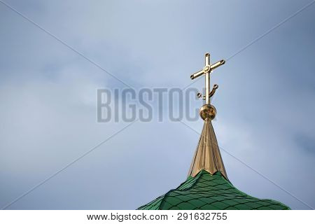 Orthodox Cross With Crescent At Church Rooftop Against Sky