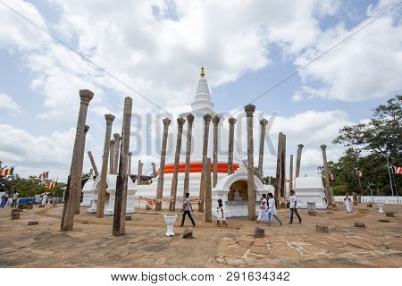 Anuradhapura, Sri Lanka - August 21, 2018: People At The Ancient Buddhist Temple Thuparamaya, The Ea