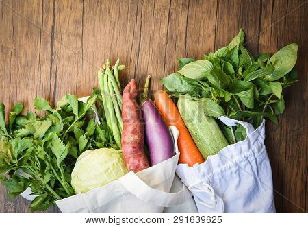 Zero Waste Use Less Plastic Concept / Fresh Vegetables Organic In Eco Cotton Fabric Bags On Wooden T