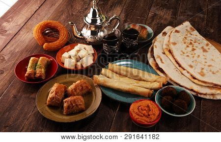 Middle Eastern Or Arabic Dishes And Assorted Meze, Concrete Rustic Background. Turkish Bread Or Turk