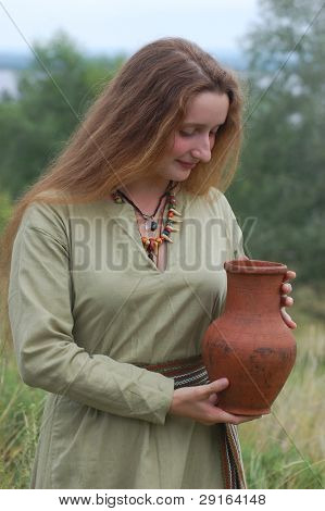 KIEV, UKRAINE - JULY 31: Member of history club Golden Capricorn wears medieval costume as she participates in historical festival in memory of King Vladimir July 31, 2009 in Kiev, Ukraine.