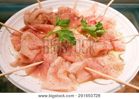 A Delicious Carpaccio Of Fresh Mediterranean Swordfish, Seasoned With Extra Virgin Olive Oil, Parsle