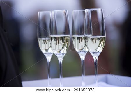 Tray With Glasses Of White Wine In Franciacorta During A Party