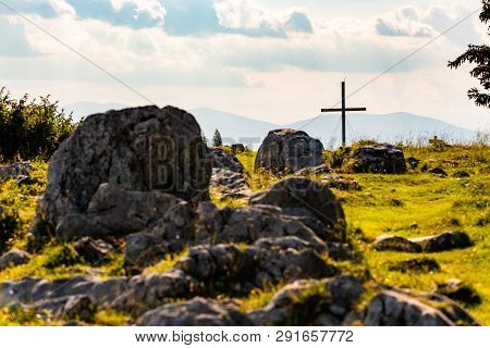 Cross On A Peak Of Rocky Austrian Mountain Schockl In Styria Graz. Place For Tourism And Hiking Recr