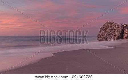 Nerja, Malaga, Andalusi, Spain - February 16, 2019: Sunrise On A Lonely And Quiet Beach On The South