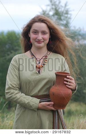 KIEV, UKRAINE - JULY 31: Member of history club Golden Capricorn wears medieval costume as she participates in historical festival in memory of King Vladimir July 31, 2009 in Kiev, Ukraine.