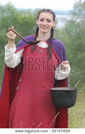 KIEV, UKRAINE - JULY 31: Member of history club Golden Capricorn wears medieval costume as she participates in historical festival in memory of King Vladimir July 31, 2009 in Kiev, Ukraine.