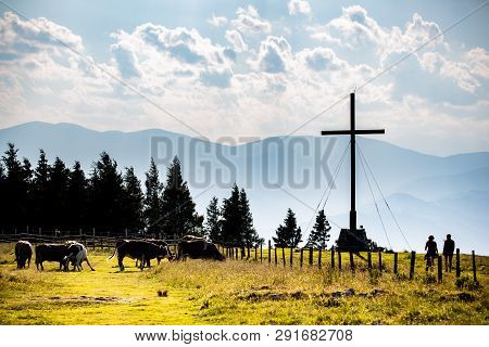 Cross On A Peak Of Rocky Austrian Mountain Schockl In Styria Graz. Place For Tourism And Hiking Recr