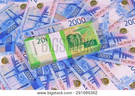 New Russian Rubles: A Pack Of Two-ruble Banknotes In A Bank Package On The Background Of Two Thousan