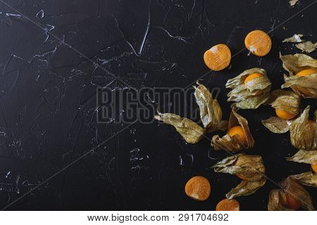 Physalis On A Dark Background. Berry  On A Dark Background. Golden Berries On A Dark Background. Pla