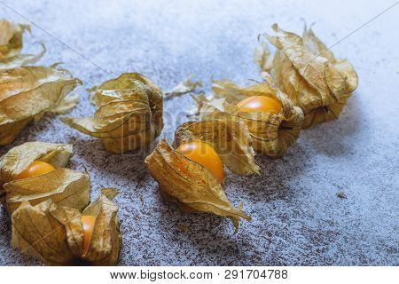 Physalis On A Light Background. Berry  On A Light Background. Golden Berries On A Light Background. 