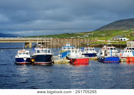 Colorful Fishing Boats And Yachts At The Harbor Of Portmagee Town On The West Atlantic Coast Of Irel