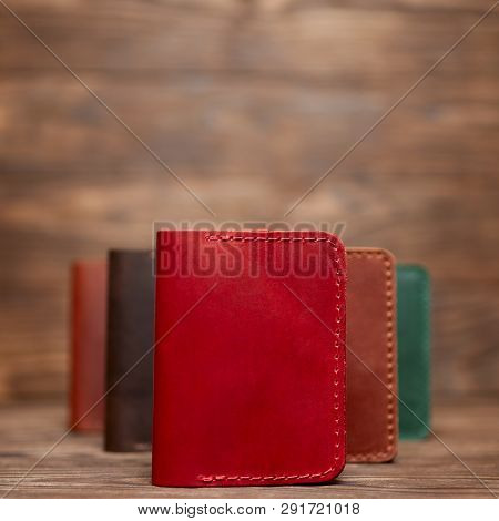 Soft Focus Photo Of Red Colour Handmade Leather Cardholder. Blurred Background On Photo. Different C