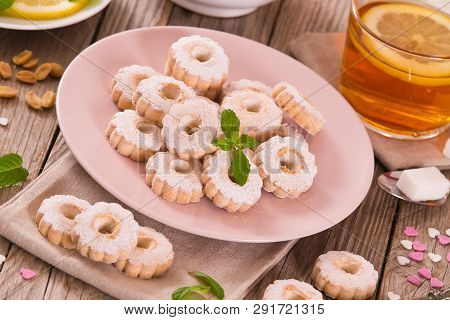 Canestrelli Biscuits With Mint On Wooden Table.