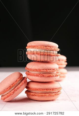Pink Stack With Macaron On White Texutured Background Isolated On Black