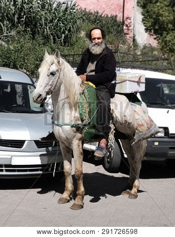 Morocco, The Market Square Of The City Of Fez. March 12 2019. Horseman Riding A Bazaar