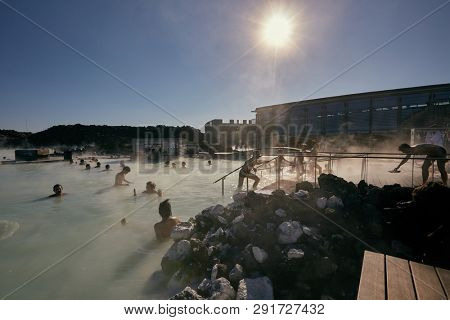 GRINDAVIK, ICELAND - MAY 04, 2015: People in popular Blue Lagoon thermal bath in Iceland, the most popular hot spring bath of the country