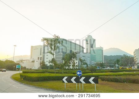 HONG KONG, CHINA - CIRCA JANUARY, 2019: Cathay City seen from double-decker bus in the morning. Cathay City is the headquarters of Cathay Pacific, Hong Kong's flag-carrying airline.
