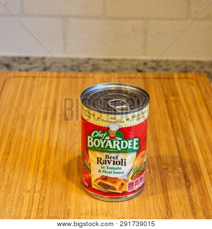A Can Of Chef Boyardee Ravioli On A Wood Cutting Board
