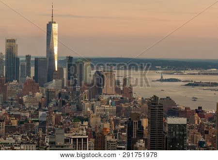 Color Landscape Photo Of The Freedom Tower In New York City. Tower Is Reflecting The Sun, Orange And