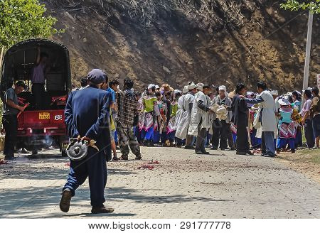 Yuanyang County, Yunnan, China - 2014: Hani Minority Villagers Gathering At A Funeral Procession