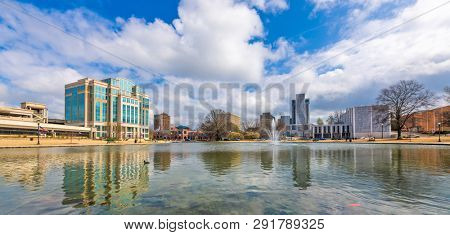 Huntsville, Alabama, USA park and downtown cityscape.