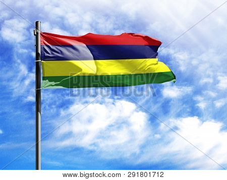 National Flag Of Mauritius On A Flagpole In Front Of Blue Sky.