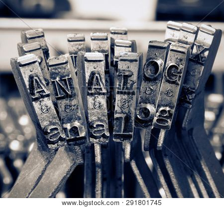 the word  ANALOG with old typwriter keys  monochrome