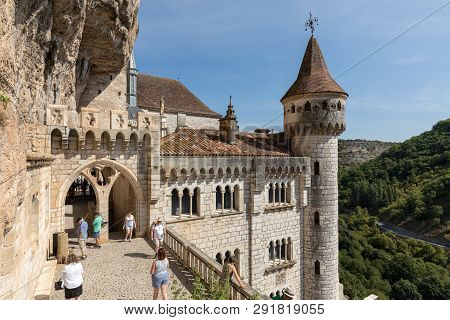 Rocamadour, France - September 3, 2018: Stone Walls Of Historic Basilica Of St-sauveur Blend Into Th