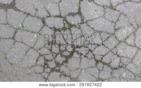 Old Asphalt Texture. Cracked Road Background Demage