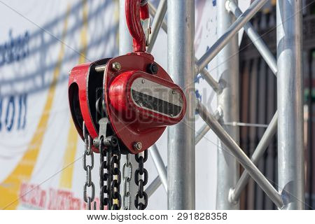Red Chain Winch Close Up Sunny Day