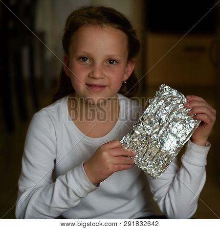 Girl Found It. Afikoman Is A Half-piece Of Matzah Which Is Broken Of The Passover Seder.in Many Fami