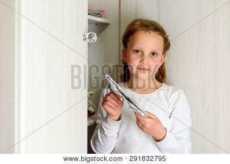 Girl Found It. Afikoman Is A Half-piece Of Matzo Which Is Broken Of The Passover Seder.in Many Famil