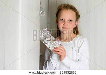Girl Found It. Afikoman Is A Half-piece Of Matzo Which Is Broken Of The Passover Seder.in Many Famil