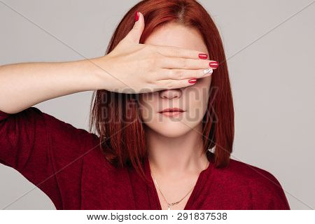 Clouse Up Of Pretty Red Haired Woman In Bordo Blouse With Headache.