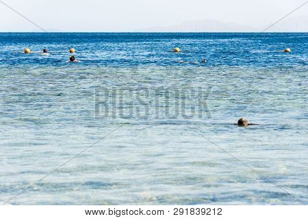Travel And Leisure, People Swim In The Blue Beautiful Sea. Horizontal Frame
