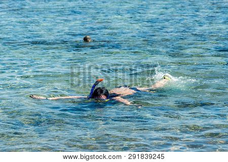 Travel And Leisure, People Swim In The Blue Beautiful Sea. Horizontal Frame