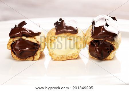 Traditional French Dessert. Eclair With Chocolate Icing. Pastery Concept With Chocolate Eclair