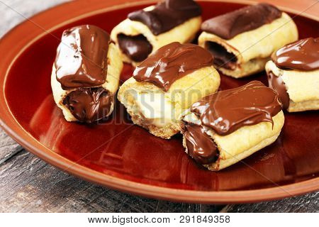 Traditional French Dessert. Eclair With Chocolate Icing. Pastery Concept With Chocolate Eclair