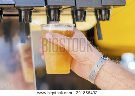 Man Pouring Fresh Drink In Self Service Bar